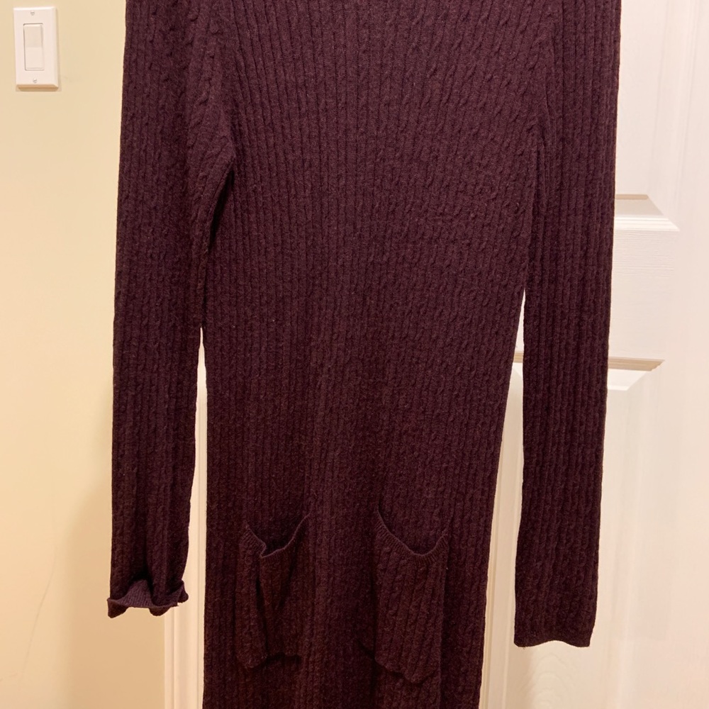 Burgundy sweater dress with black leather trim. Patch pockets. Flattering fit.